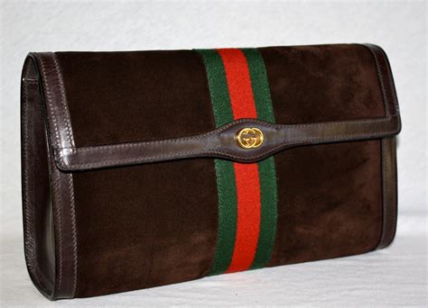 vintage gucci monogram clutch|gucci vintage suede clutch.